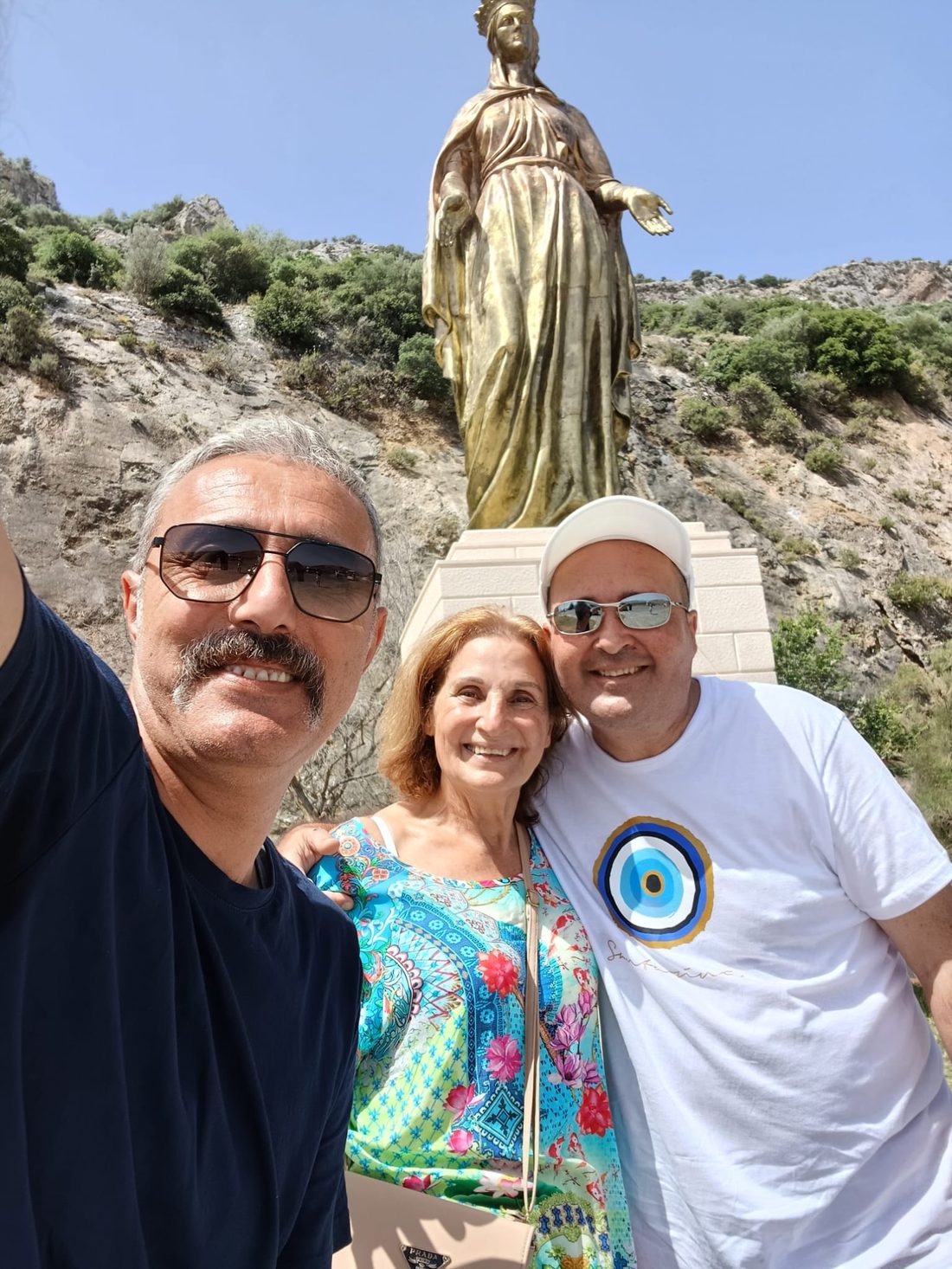 Guests with Akın at the Virgin Mary statue near Ephesus